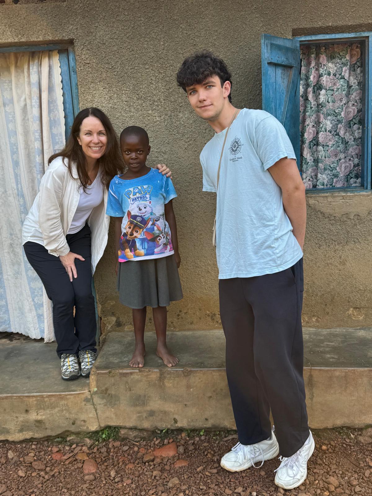 Denise Blasevick with child in Uganda